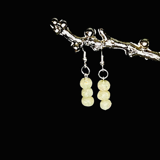 3 beads, off white color sparkly earrings, silver hooks, set on black background